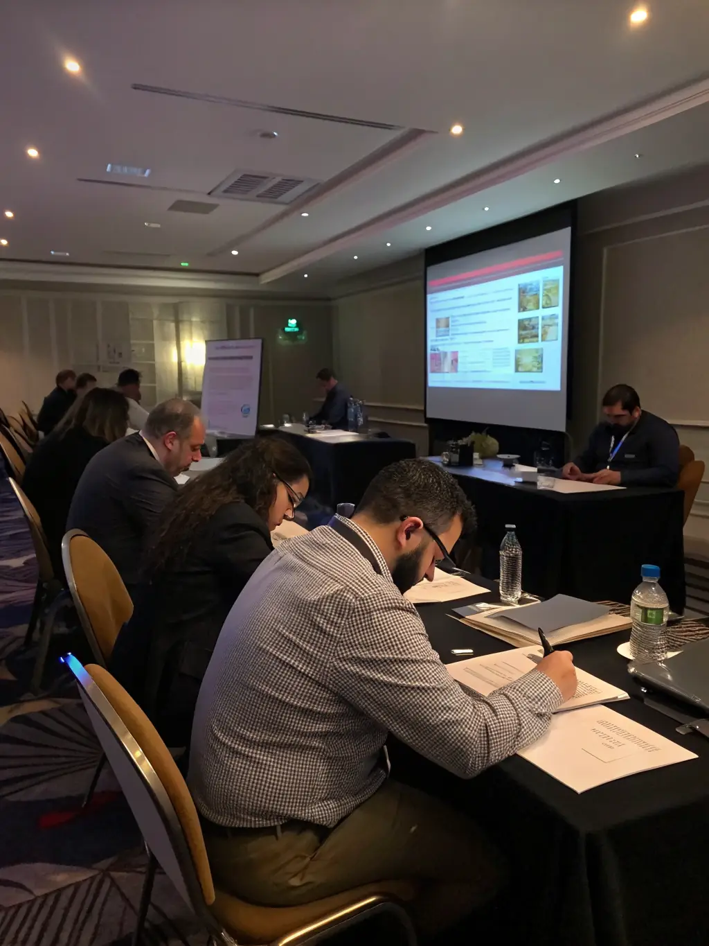 A diverse group of professionals participating in an interactive training session, led by a skilled facilitator, showcasing JY America LLC's training and development programs.